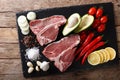 Organic raw t-bone beef steak with ingredients close-up. horizon Royalty Free Stock Photo