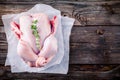 Organic raw whole chicken on wooden background