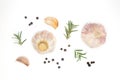 Organic raw whole garlic, black pepper and fresh rosemary on white isolated background in top view flat lay. Popular aromatic herb Royalty Free Stock Photo