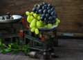 Organic ripe grapes on scales Royalty Free Stock Photo