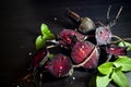 Organic roasted beetroots on dark background.