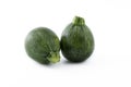 Organic round green courgettes zucchini, isolated