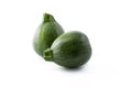 Organic round green courgettes zucchini, isolated