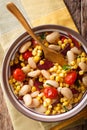 organic salad succotash from the butter beans, tomatoes and bacon close up in a bowl. Vertical top view Royalty Free Stock Photo