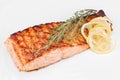 Organic salmon red fish fillet grilled with spices, lemon slices and rosemary Royalty Free Stock Photo