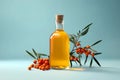 Organic sea buckthorn oil in the bottle with fresh ripe sea buckthorn berries and leaves on pastel background. Natural cosmetic