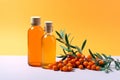 Organic sea buckthorn oil in the bottles with fresh ripe sea buckthorn berries and leaves on pastel background. Natural cosmetic