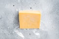 Organic Sharp Cheddar Cheese in vacuum packaging. Gray background. Top view