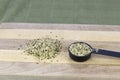 Organic Shelled Hemp Seed Hearts on a Cutting Board in Two Areas Royalty Free Stock Photo