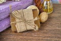 Organic soap, purple sauna towel and decoration on walnut tree background,layout with free text space