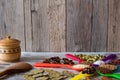 Organic spices in the colorful spoons. Black pepper, cardamom, coriander, mustard seeds, bay leaf and other. Royalty Free Stock Photo