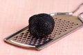 organic summer truffle on a grater Royalty Free Stock Photo