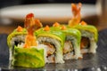 Organic sushi roll with shrimp tempura at restaurant