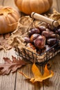 Organic sweet chestnuts in a basket on kitchen table