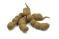 Organic Thai tamarind on white isolated background with clipping path. Ripe tamarind is herb have sweet and sour taste can use for