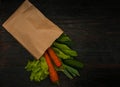 Organic vegetables. bag of products on a dark wooden background Royalty Free Stock Photo