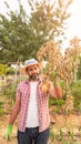 Organic vegetables. Fresh potatoes in the hands of male farmer. Cheerful man Royalty Free Stock Photo