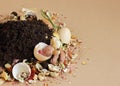 Rganic waste, heap of biodegradable vegetable compost with decomposed organic matter on top