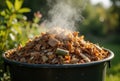 Overflowing compost bin with steam under natural sunlight, promoting sustainability and recycling Royalty Free Stock Photo
