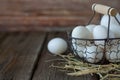Organic white chicken eggs in basket on rustic background Royalty Free Stock Photo