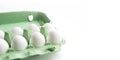 Organic white chicken eggs in carton green box Royalty Free Stock Photo