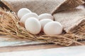 Organic white eggs on vintage wooden background. Royalty Free Stock Photo