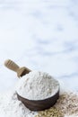 Organic white flour Thai in wooden bowl with white rice Thai and rice ears isolated on tone background, Food and baking ingredient Royalty Free Stock Photo