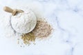 Organic white flour Thai in wooden bowl with white rice Thai and rice ears isolated on tone background, Food and baking ingredient Royalty Free Stock Photo