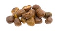 Organic whole shelled roasted chestnuts on a white background