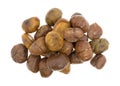 Organic whole shelled roasted chestnuts on a white background