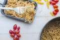 Organic whole wheat bunch of raw italian spaghetti pasta on a white table background, selective focus. Royalty Free Stock Photo