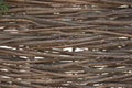 Organic woven willow wicker fence panel suitable for crafts, picnic or gardening background.
