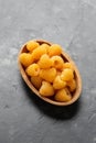 Organic Yellow Raspberries in wooden bowl. Ripe juicy fresh berry fruit.. Healthy food.