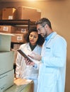 An organised pharmacy takes an organised team. a young woman and mature woman using a digital tablet while doing Royalty Free Stock Photo