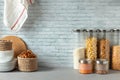 Organising zero waste storage in kitchen. Pasta and cereals in reusable glass containers in kitchen