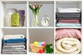 Organization of storage. Stacks of towels, sheets, bed linen, blankets and pillows on a white shelf. Easter celebration