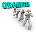 Organize Word Pulled by Team Workers Union Working Together Royalty Free Stock Photo