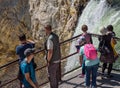 YELLOWSTONE NATIONAL PARK, WYOMING, USA - JULY 17, 2017: Organized group of tourists with a guide watching and taking pictures of