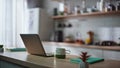 Organized home workspace laptop in remote kitchen office closeup. Online work Royalty Free Stock Photo