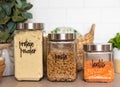 Organized kitchen pantry with labeled glass canisters