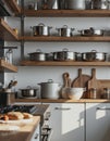 Organized kitchen storage featuring various culinary equipment and pots Royalty Free Stock Photo