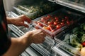 Organized refrigerator stocked with fresh vegetables promoting healthy eating.