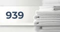 Organized stack of white towels with number 939 Royalty Free Stock Photo