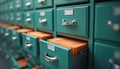Organized teal file cabinet with many drawers. Drawer holds many documents. Drawers open, showing stacks of files inside. Photo
