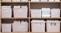 Organized white boxes on shelves create a grid pattern suggesting storage and logistics Royalty Free Stock Photo