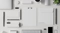 Organized white office desk with various stationery items. Royalty Free Stock Photo