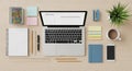 Organized workspace featuring a laptop open with a minimal design interface Royalty Free Stock Photo