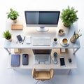 Organized workspace with various digital devices and plants Royalty Free Stock Photo