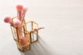 Organizer with makeup brushes and sponge on table Royalty Free Stock Photo