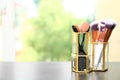 Organizer with makeup brushes on table Royalty Free Stock Photo